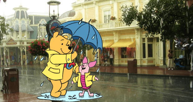 Winnie the Pooh and Piglet, dressed in raincoats, share an umbrella as they stroll down a rainy street with gentle thunderstorms, surrounded by the enchanting Disney World-inspired buildings in the background.
