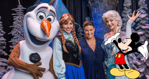 Mickey Mouse joins Olaf, Anna, Elsa, and a cheerful guest for a magical photo op in Disney World’s snowy, winter-themed setting—where the enchantment of Elsa and her friends lights up the park experience.