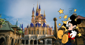 Mickey Mouse stands proudly next to a shimmering golden sword before the iconic fairytale castle with its blue spires at Disney World, ready to welcome fans and defend the magic from any surprise—maybe even a runaway truck!.