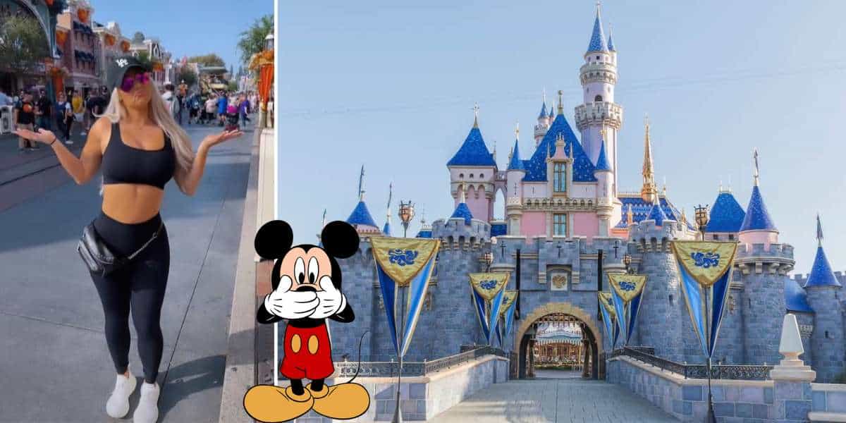 Fashion-forward Disney fan rocks an all-black outfit featuring a bold Mickey Mouse graphic, posing in front of the iconic Sleeping Beauty Castle at Disneyland and flawlessly embracing Disney’s park style code.