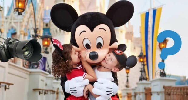 Two kids excitedly hug Mickey Mouse at Disney World, outdoors in a lively setting. A camera and a question mark are added to highlight the magic of capturing unforgettable moments with Memory Maker.