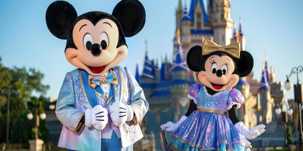 mickey and minnie in front of cinderella castle wdw 50th