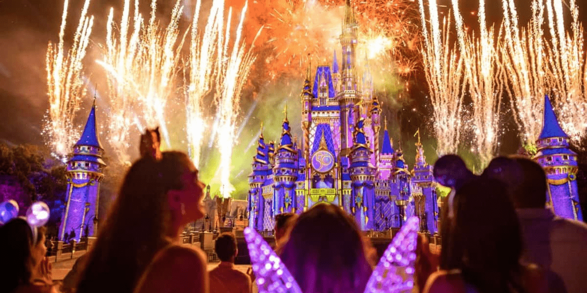 Fireworks light up the night sky above Cinderella Castle, casting a magical glow over New Year’s Eve at Disney World. Guests in glowing headbands and colorful costumes celebrate together, immersed in festive Disney entertainment and wonder.