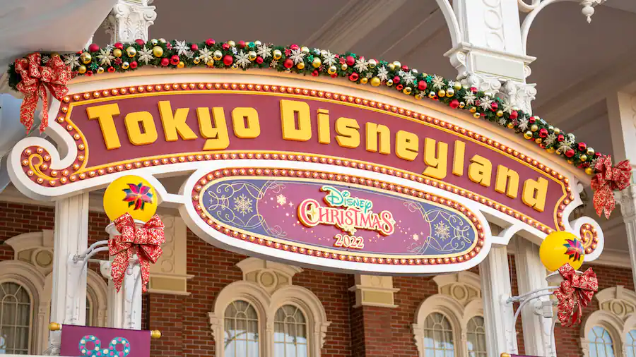 Disney Christmas decorations over the Tokyo Disneyland sign