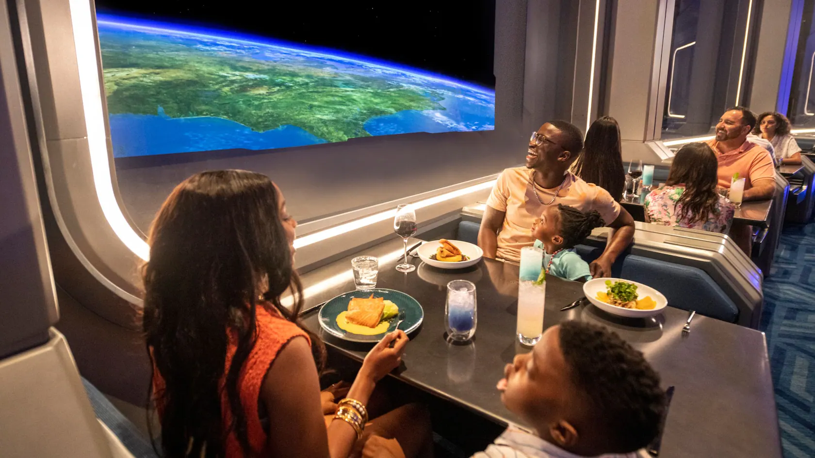 family enjoying a meal in space 220