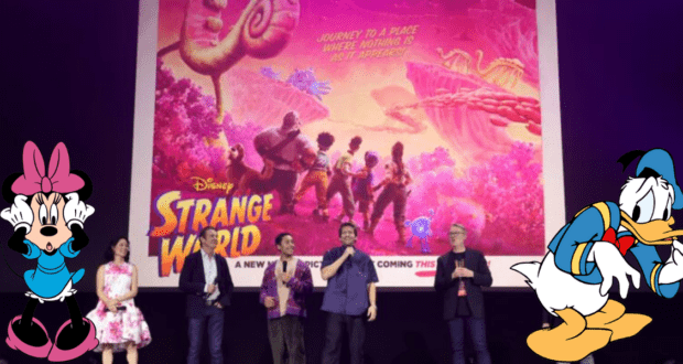 Five performers take the stage beneath a vibrant "Strange World" poster, joined by playful Minnie Mouse and Donald Duck illustrations, as they revel in the excitement of the film's theatrical debut for Disney fans.