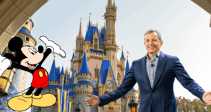 Mickey Mouse poses alongside Disney CEO Bob Iger in front of the iconic Disney castle at Disney World on a bright, sunny day.