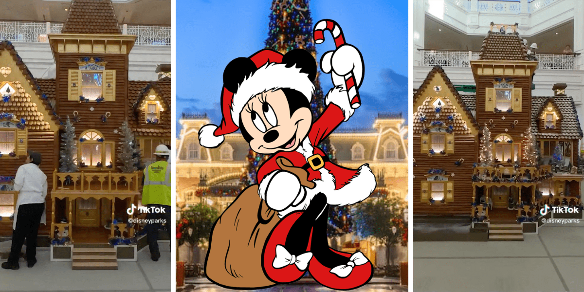 The iconic Grand Floridian gingerbread house taking shape with skilled cast members at work, as Minnie Mouse dressed in her festive Santa outfit greets guests and poses with a candy cane.
