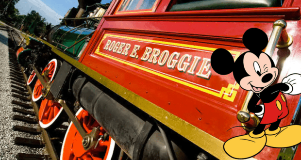 The iconic red Roger E. Broggie steam train chugs along the Walt Disney World Railroad, while Mickey Mouse waves in the foreground, capturing the magic and excitement of Disney World.