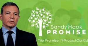 Disney CEO Bob Iger stands next to the Sandy Hook Promise logo and slogan, set against a green backdrop where children are softly blurred, emphasizing his commitment to gun safety advocacy within the entertainment industry.