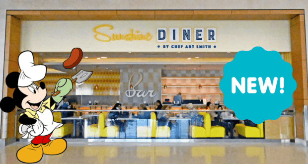 Mickey Mouse dressed as a chef welcomes guests at the entrance of Sunshine Diner inside Orlando Airport, with a vibrant blue "NEW!" sign inviting Disney fans to check out the latest offerings.