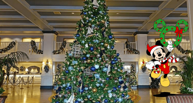 Mickey Mouse in a Santa hat welcomes guests in a dazzling, Disney World–inspired lobby, standing by a grand Christmas tree adorned with festive decorations and holding a sparkling holiday wreath, evoking the heartwarming magic of the season at the park.
