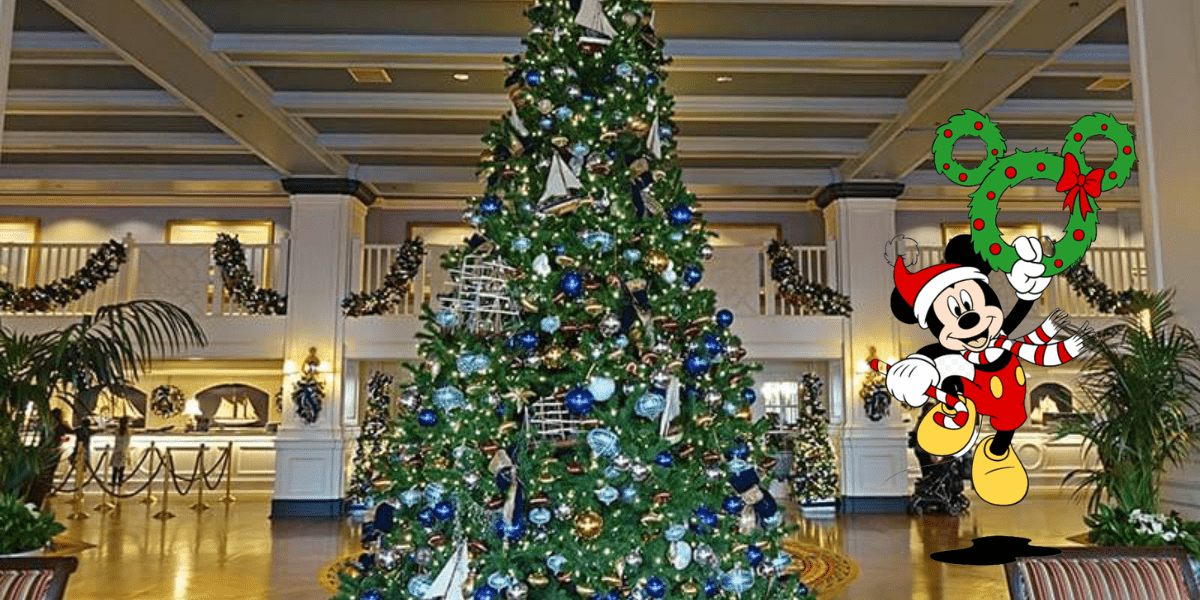 Mickey Mouse in a Santa hat welcomes guests in a dazzling, Disney World–inspired lobby, standing by a grand Christmas tree adorned with festive decorations and holding a sparkling holiday wreath, evoking the heartwarming magic of the season at the park.