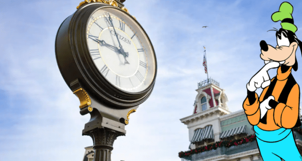 Goofy poses next to a classic outdoor clock and a building flying the American flag at a Disney park, all set beneath a bright blue sky, radiating the whimsical atmosphere fans love in Disney’s movie-inspired attractions.