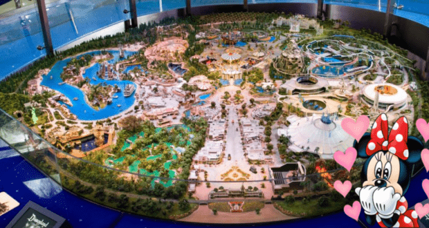 A vibrant miniature of Disneylandia featuring Minnie Mouse in the bottom right corner, playfully blowing a kiss to fans.