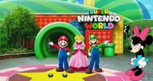 Mario, Luigi, and Princess Peach strike a fun pose inside Super Nintendo World at Universal Nintendo Land, while Minnie Mouse looks on from the right with an amusingly annoyed expression.