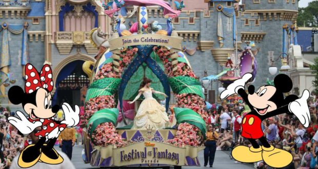 Belle, Minnie Mouse, and Mickey Mouse wave to excited guests from a vibrant Disney parade float during the Festival of Fantasy Parade, with spectators enjoying the spectacle in front of Cinderella Castle’s colorful backdrop.