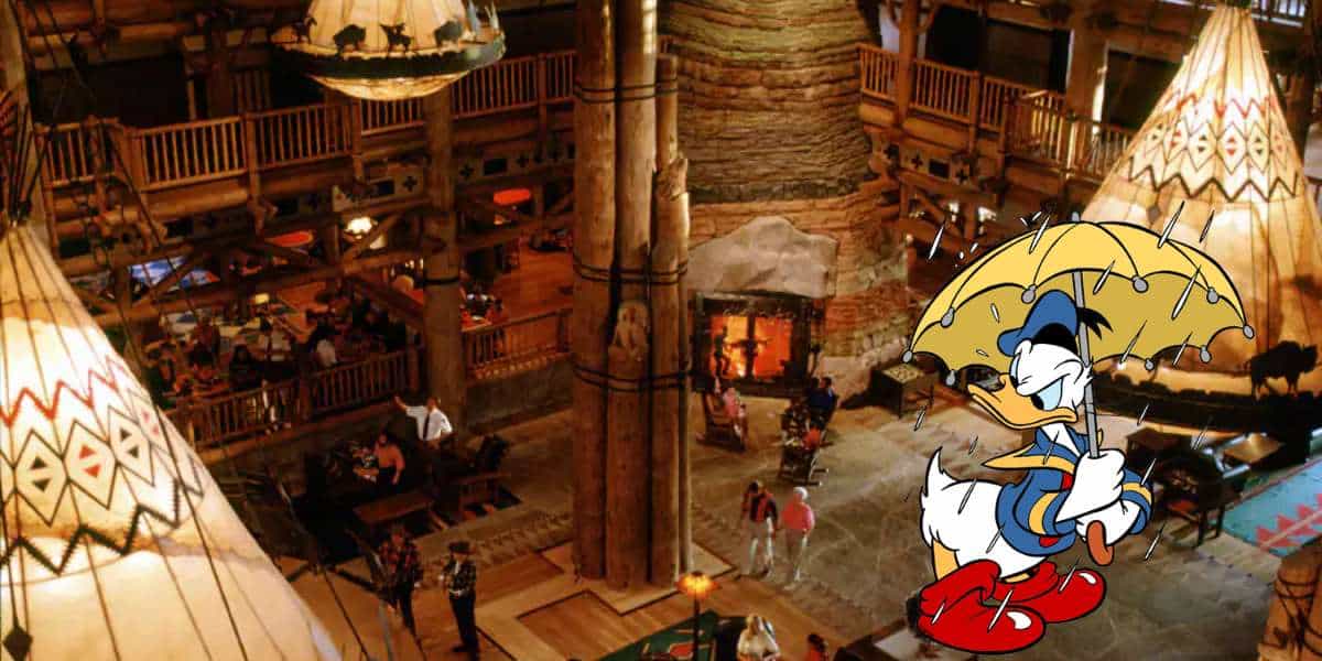 Donald Duck, umbrella in hand, welcomes guests inside the impressive Disney Wilderness Lodge Resort, surrounded by iconic wooden beams and rustic teepees that capture the magic of Disney’s wilderness-themed destination.