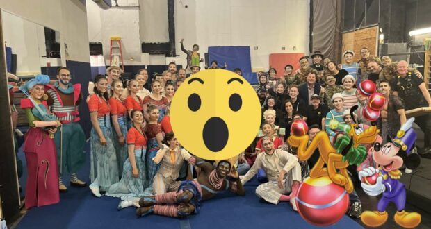 Guests in vibrant costumes gather inside a themed event space, with colorful emoji icons and iconic Disney animated characters featured prominently in the foreground for an immersive entertainment experience.
