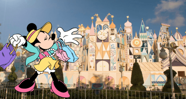 Minnie Mouse shows off her latest shopping finds while posing in front of the iconic "it's a small world" attraction at Disneyland, capturing the magic and excitement of a day at the park.