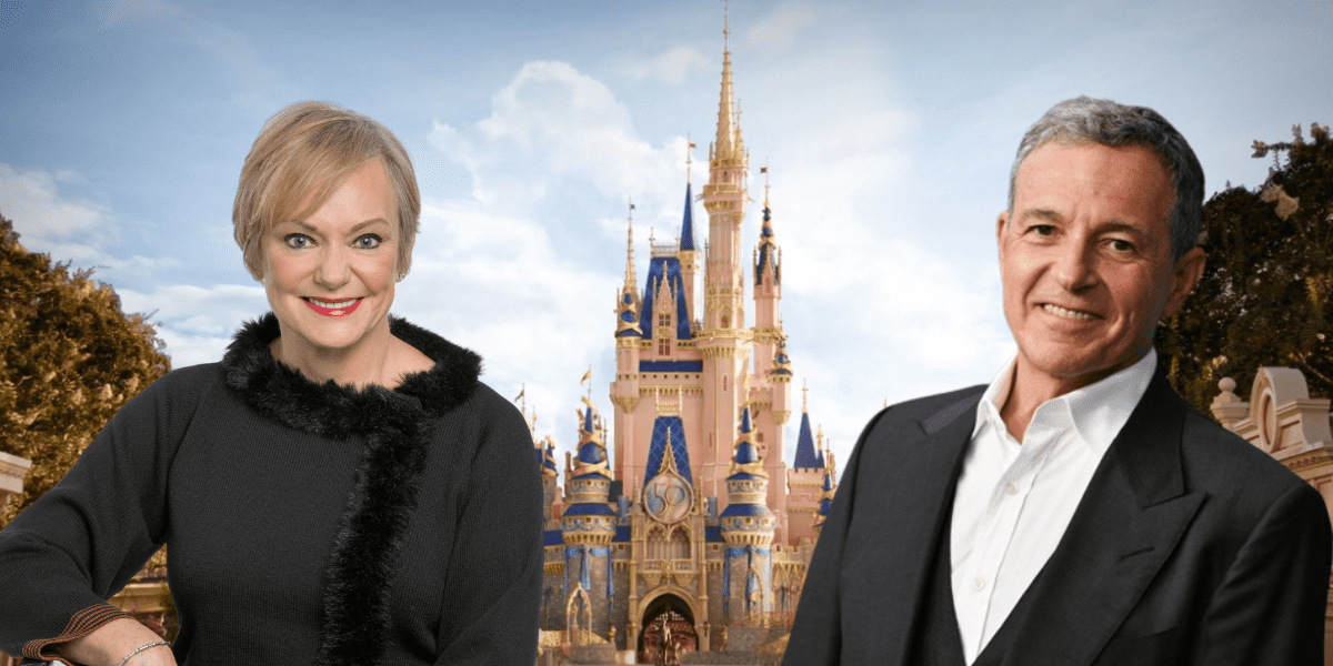 Guests beaming with joy in front of Cinderella Castle at Walt Disney World, its iconic blue and gold turrets shining against a clear sky, capturing the magic and wonder that define a day at Disney.