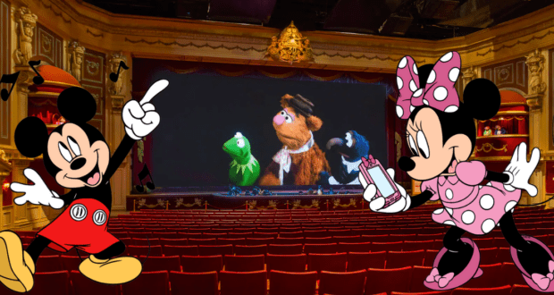 Mickey Mouse and Minnie Mouse sit side by side in the theater at Disney’s Hollywood Studios, delighting in the lively Muppets 3D show unfolding on stage.