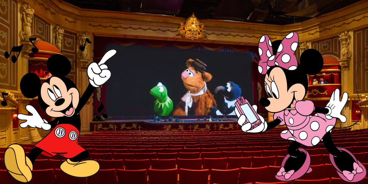Mickey Mouse and Minnie Mouse sit side by side in the theater at Disney’s Hollywood Studios, delighting in the lively Muppets 3D show unfolding on stage.