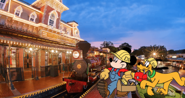 Mickey Mouse and Pluto, dressed in construction gear, greet guests in front of the glowing Walt Disney World Railroad station at sunset, capturing the magic of Disney Parks as day turns to night.