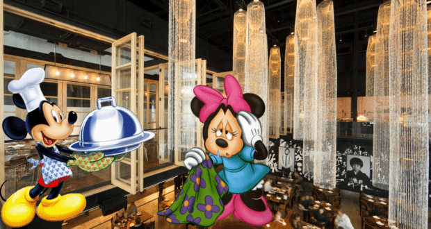 Mickey Mouse delights Minnie Mouse by serving her a delicious meal inside a stylish restaurant, illuminated by glowing lanterns and warm wooden accents, capturing the upscale Disney Springs vibe reminiscent of Morimoto Asia.