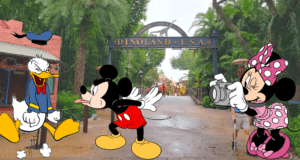 Mickey Mouse strikes a playful pose while Donald Duck looks ready for mischief in Dinoland U.S.A., as Minnie Mouse snaps a photo, all set against the vibrant backdrop of Disney World’s Dinoland U.S.A.