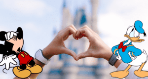 Mickey Mouse and Donald Duck stand together in front of a softly blurred Disney castle, forming a heart shape with their hands to capture the joyful, welcoming spirit that defines the guest experience at Walt Disney World.