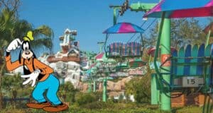 Goofy greets guests in front of the vibrant ski lift at Disney’s Blizzard Beach, surrounded by snowy mountain backdrops and palm trees, offering a taste of frosty fun even while the water park is temporarily closed.