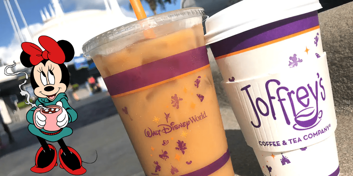 Two Disney-themed Joffrey’s Coffee cups and Minnie Mouse enjoying a mug, set against the backdrop of a charming park building, perfectly capture the whimsical ambiance and excitement of Walt Disney World.