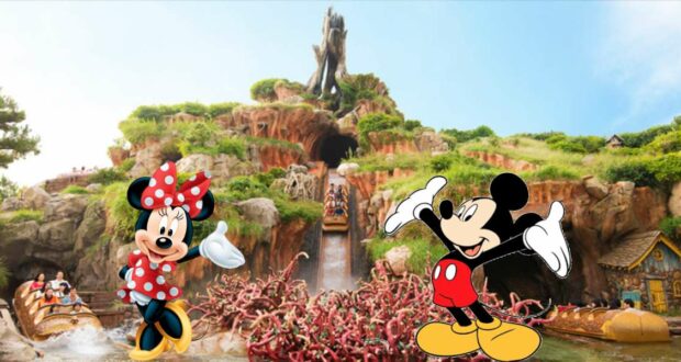 Minnie and Mickey Mouse greet guests in front of Splash Mountain’s iconic log flume at Disney World, surrounded by the mountain’s rugged peaks and lush greenery.