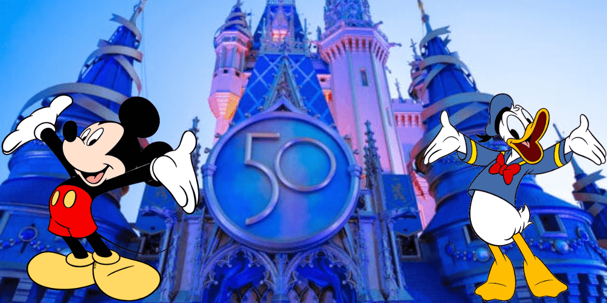 Mickey Mouse and Donald Duck pose together in front of Cinderella Castle, with a shimmering "50" sign at the entrance, celebrating Walt Disney World's 50th Anniversary and magical extended park hours.