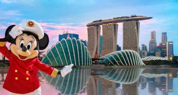 Minnie Mouse, dressed as a cruise captain, greets fans in front of the iconic Marina Bay Sands and Gardens by the Bay to celebrate Disney Cruise Line’s debut in Singapore.