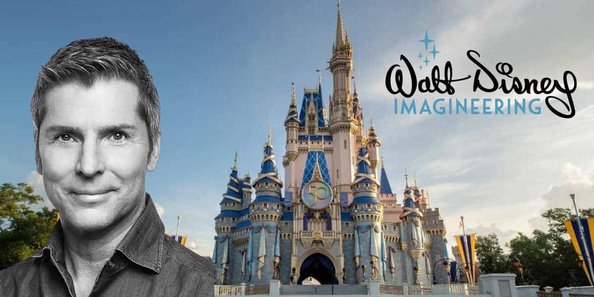 Bruce Vaughn of Walt Disney Imagineering posing with Cinderella Castle and the Imagineering logo in the background on a bright Disney day.