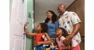 Guests unlocking stateroom door with DisneyBand+ on Disney Cruise Line