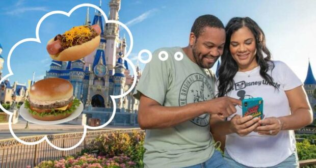 At Disney World, a couple checks their phone, debating between ordering a cheesy cheeseburger or a hot dog with cheese using Mobile Order as they plan their next delicious treat.