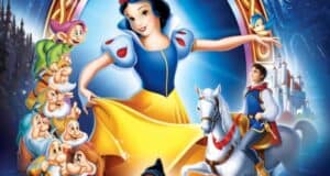 Colorful illustration of a princess with dark hair, resembling the Snow White live action remake, in a blue and yellow dress, surrounded by seven dwarfs, a prince on a white horse, and a castle in the background. A bird is perched on the prince's hand.