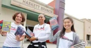 Disney Voluntears hold books