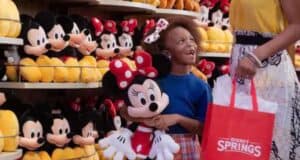 Girl Holding Minnie Mouse at Disney Springs