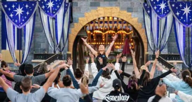 Cast Members Do Yoga in front of Sleeping Beauty Castle at Disneyland
