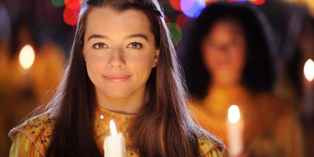 Girl holding candle at EPCOT Processional