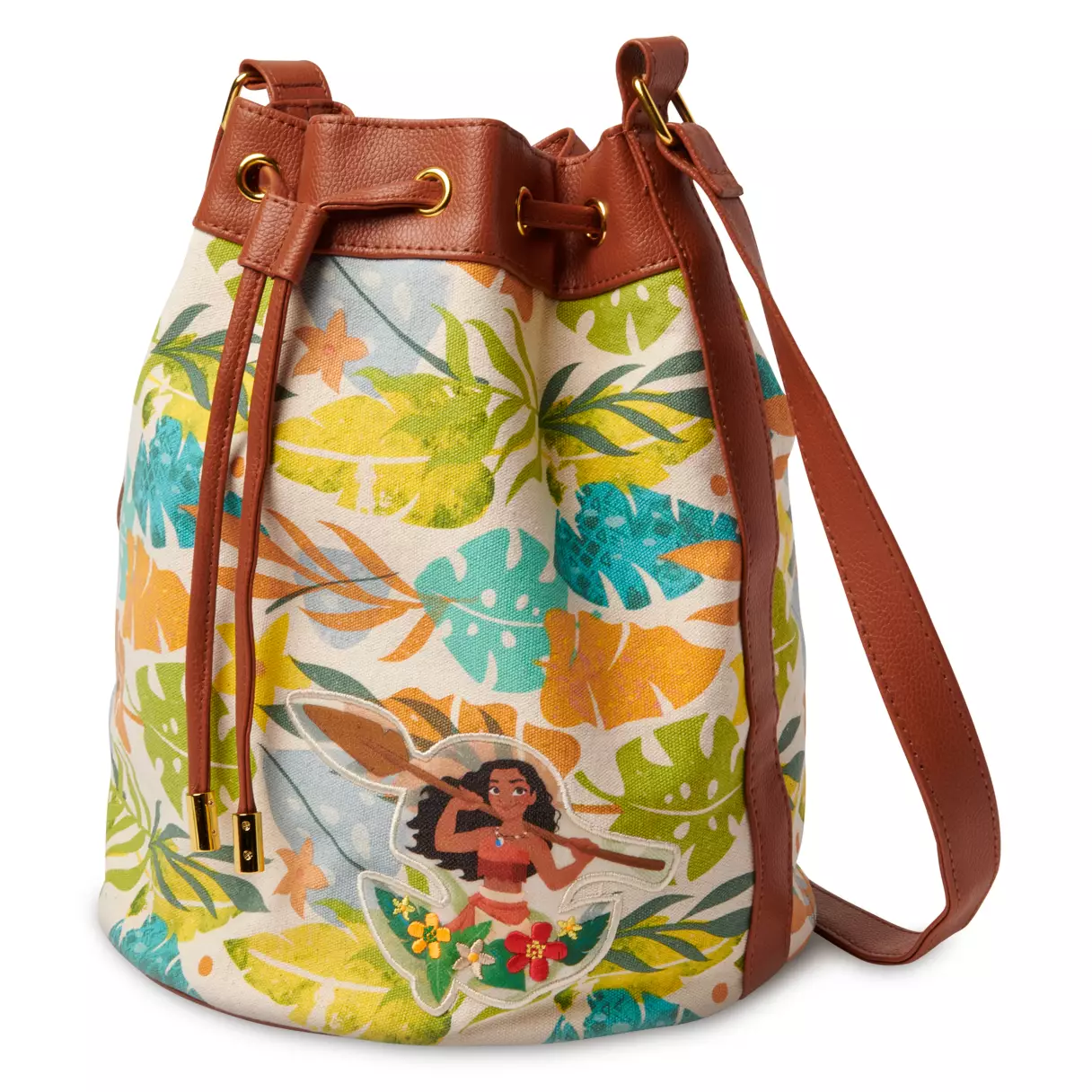 A tropical leaf-print bucket bag with brown straps, featuring a patch of Moana holding her oar on the front—ideal for Disney Parks enthusiasts looking to bring a bit of adventure-inspired style to their visit or everyday lineup.