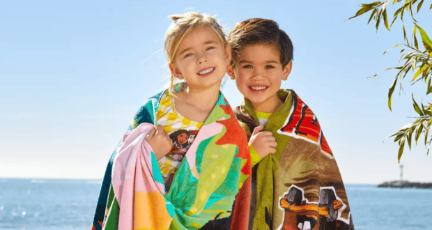 Kids wearing Disney-themed towels