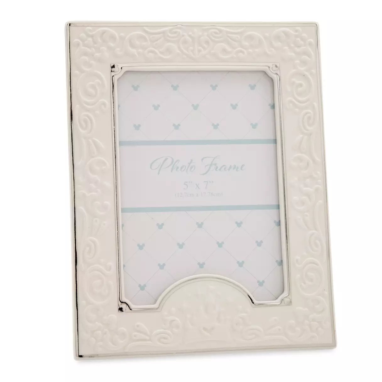 Ornate white photo frame with embossed swirls inspired by Disney Parks merchandise, displaying a sample insert labeled "Photo Frame 5" x 7".