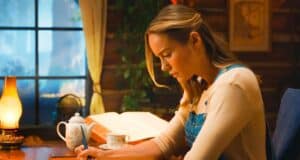 Brie Larson character writing at table