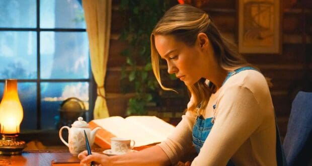 Brie Larson character writing at table