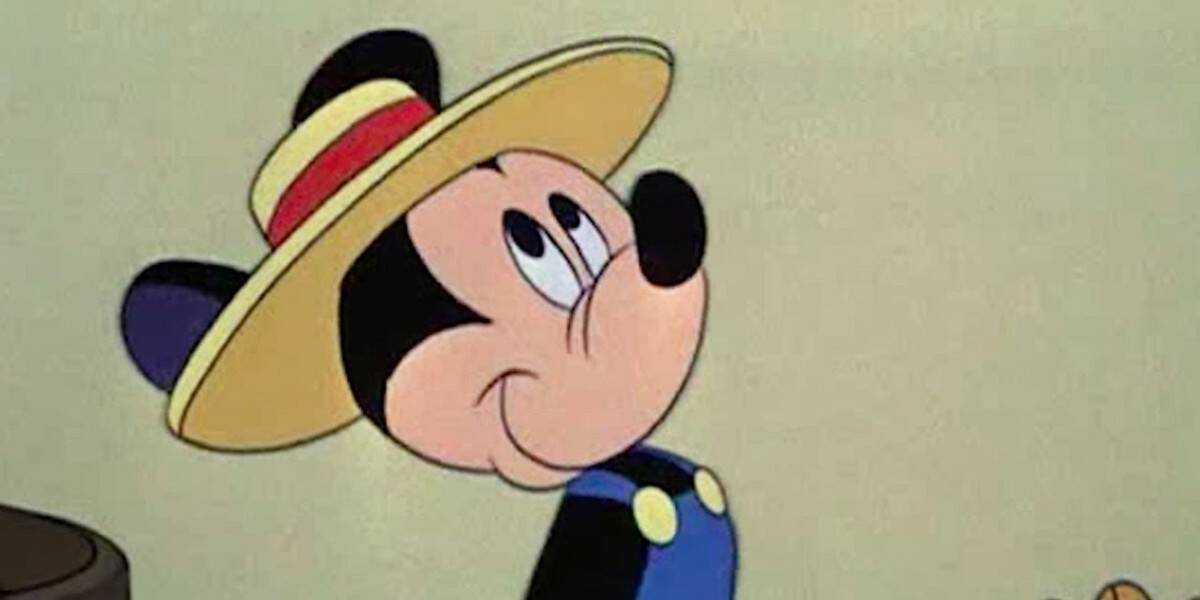 Mickey mouse with a blue shirt and a hat